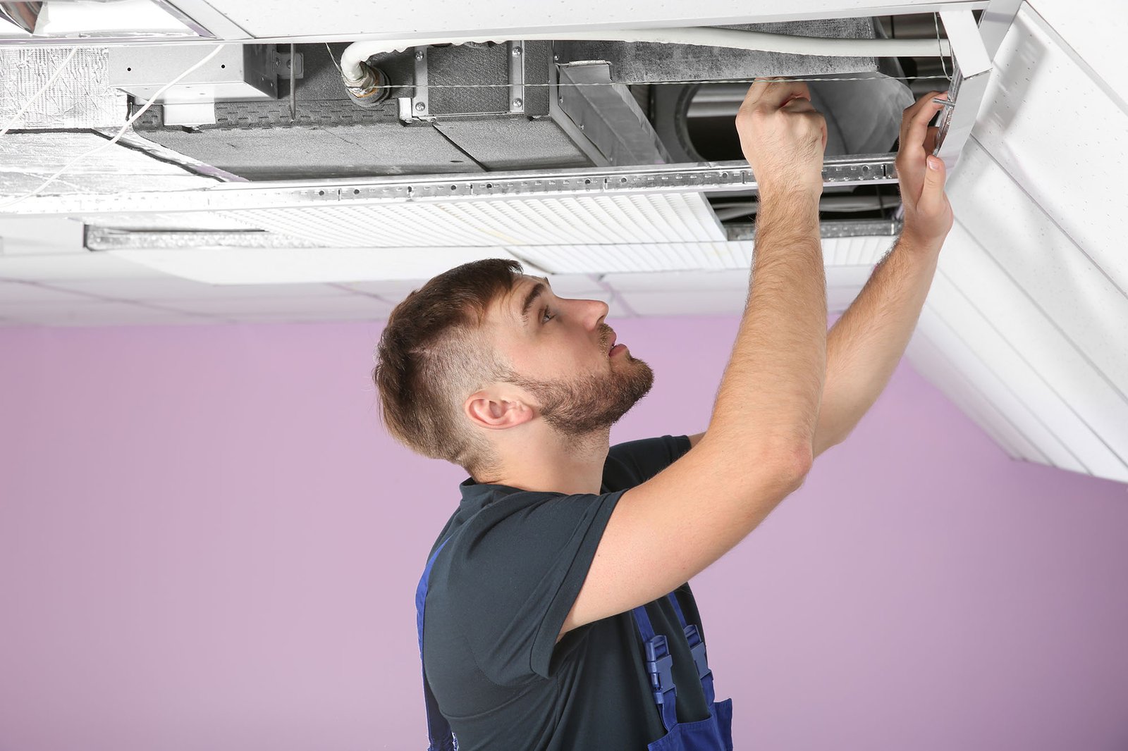 HVAC technician servicing commercial equipment